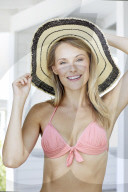 Young blond woman in pink bikini