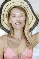 Young blond woman in pink bikini