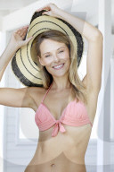 Young blond woman in pink bikini