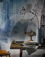 Still Life with Plates and Branches on a wooden Table