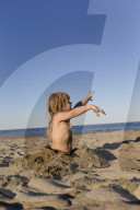 Blonde Girl having Fun at the Beach