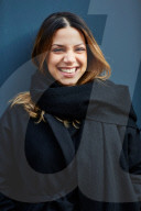  Woman wearing a black Coat and a Scarf