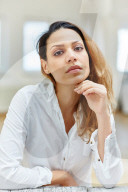 Sad Woman wearing a white Shirt 