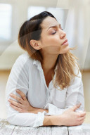 Sad Woman wearing a white Shirt 