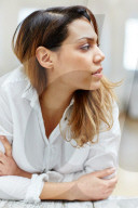 Sad Woman wearing a white Shirt 