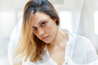 Sad Woman wearing a white Shirt 