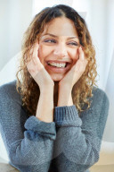 Portrait of a happy Woman with curly Hair 