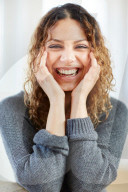 Portrait of a happy Woman with curly Hair 
