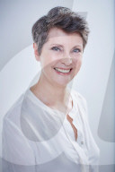 Mature Woman wearing a white Blouse