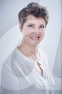 Mature Woman wearing a white Blouse