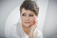Mature Woman wearing a white Blouse