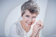 Mature Woman wearing a white Blouse