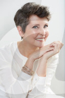 Mature Woman wearing a white Blouse