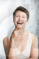 Mature Woman pointing at Someone