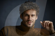  Young Man wearing a brown Turtleneck Pullover