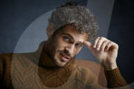  Young Man wearing a brown Turtleneck Pullover