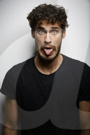 Grimacing young Man wearing a dark T-Shirt