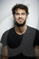 Happy young Man wearing a dark T-Shirt