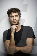  Young Man wearing a dark T-Shirt