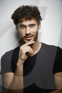  Young Man wearing a dark T-Shirt