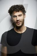  Young Man wearing a dark T-Shirt