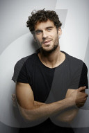  Young Man wearing a dark T-Shirt