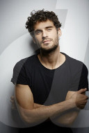  Young Man wearing a dark T-Shirt