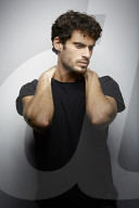  Young Man wearing a dark T-Shirt