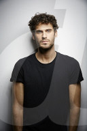  Young Man wearing a dark T-Shirt