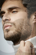 Young Man wearing a white Turtleneck