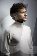 Young Man wearing a white Turtleneck