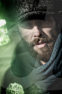 Portrait of a Man wearing Flat Cap and Scarf