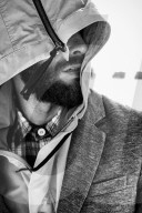 Portrait of a Man wearing a hooded Jacket