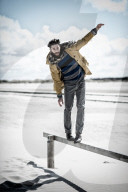 Lonesome Man at the Beach balances on Balustrade