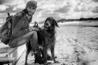 Lonesome Man with his Dog at the Beach