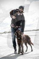 Lonesome Man with his Dog at the Beach