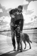 Lonesome Man with his Dog at the Beach