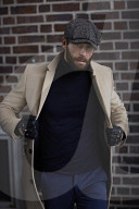 Man standing in front of a Brick Wall