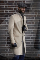 Man standing in front of a Brick Wall