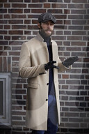 Man standing in front of a Brick Wall