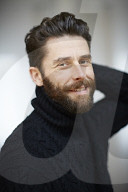  Portrait of a Man wearing a black Turtleneck