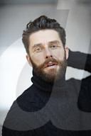  Portrait of a Man wearing a black Turtleneck