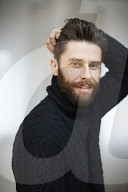  Portrait of a Man wearing a black Turtleneck