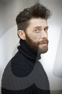  Portrait of a Man wearing a black Turtleneck