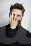  Portrait of a Man wearing a black Turtleneck
