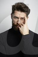  Portrait of a Man wearing a black Turtleneck