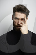  Portrait of a Man wearing a black Turtleneck