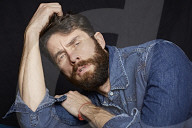  Man with Full Beard wearing a Denim Jacket