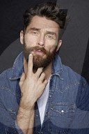  Man with Full Beard wearing a Denim Jacket