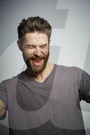 Man with Full Beard in a Flush of Victory